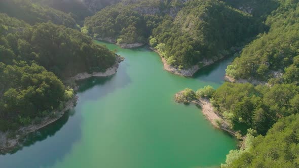 Aerial Video of Mountain Lake and Mountains at Sunset alt