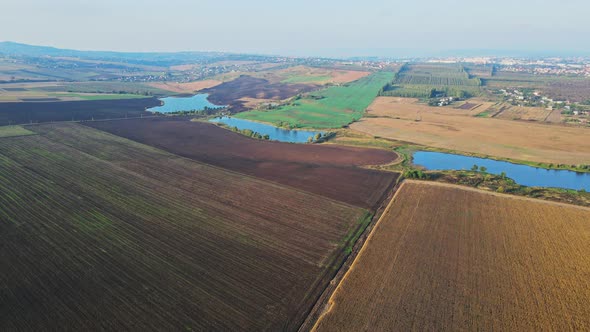 Flight over the fields behind the western Ukrainian village Aerial view.