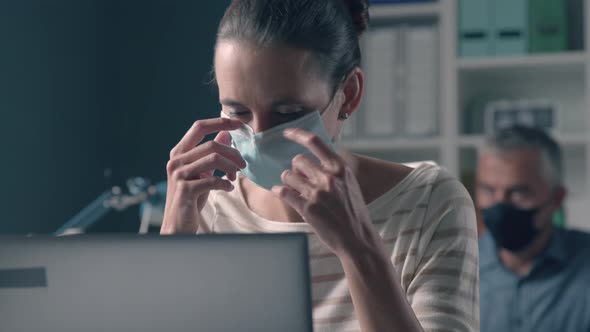 Woman wearing a face mask and having breathing problems