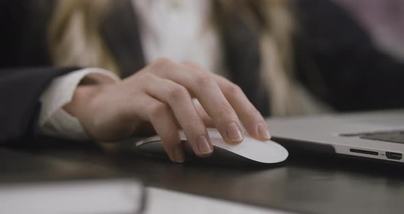 A Closeup Shot of a Woman's Hand Clicking Computer's Mouse