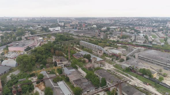 Aerial of an industrial area near a city alt