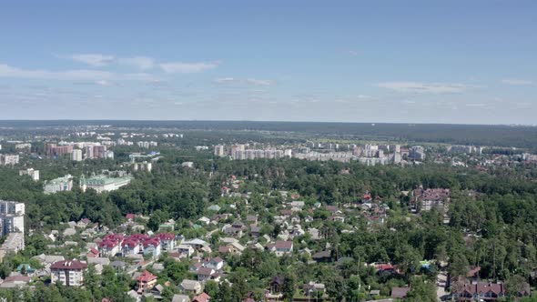 Urban Buildings Between Green Trees