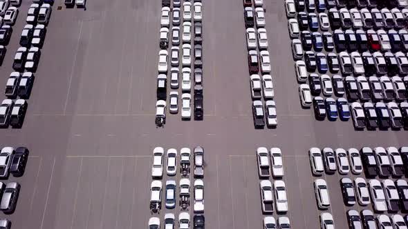 Aerial view of logistics concept of commercial vehicles, cars and pickup trucks waiting to be load o alt