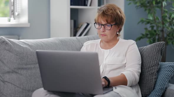 Senior Woman Using Laptop for Work