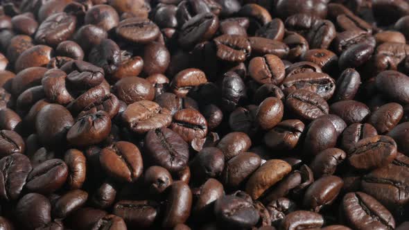 Lot of roasted coffee beans  4K slow pan video alt