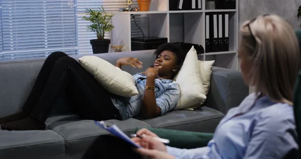 Young Woman Talking To a Psychologist alt