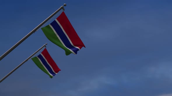 The Gambia  Flags In The Blue Sky - 4K