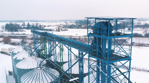 Aerial View of the Silo System Plant for Storage and Processing of Grain Covered in Snow in Warsaw alt