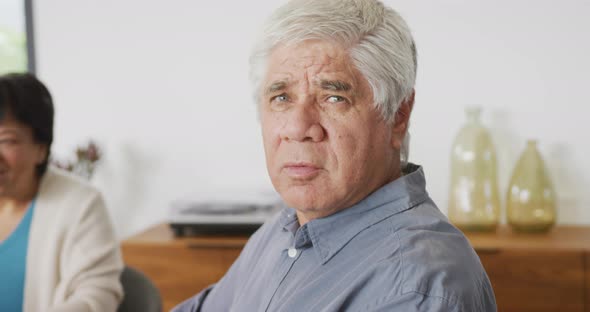 Portrait of happy senior diverse people having dinner at retirement home alt