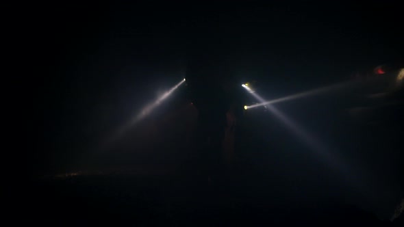 Firefighters during a rescue operation in a dark tunnel filled with smoke alt