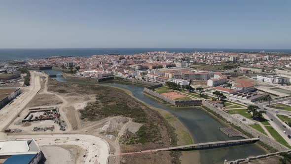 Aerial view shallow waters canal towards ocean at Peniche Cityscape