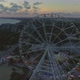Aerial view of the Ferris wheel on the beach at sunset - VideoHive Item for Sale