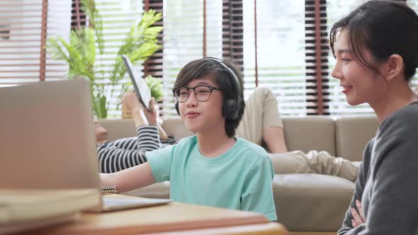 cheerful asian child boy online lesson study from home concept