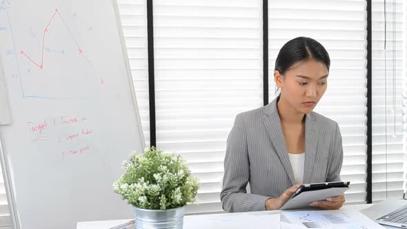 Asian business woman working in office