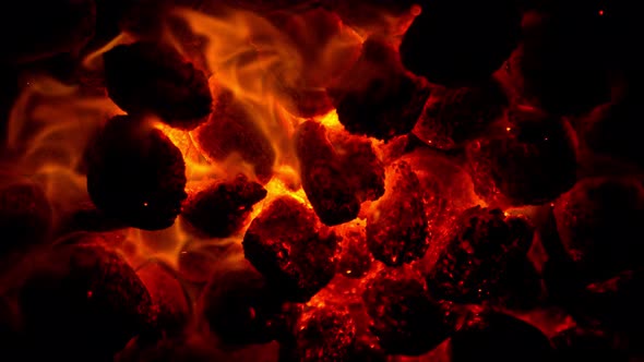 Super Slow Motion Shot of Glowing Coal and Fire Sparks at 1000Fps alt