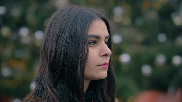 Romantic attractive young lovers flirting in the city at Christmas alt