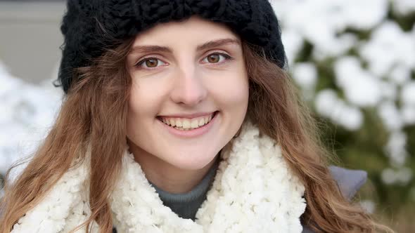 Close-up Portrait of Nice-Looking Curly Elegant Woman Looking Into Camera Stand on Winter Street alt