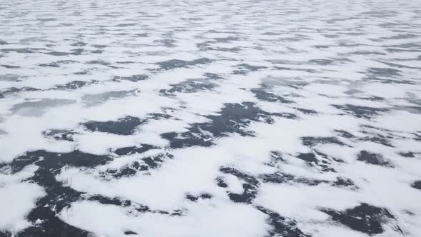 Aerial Drone View Rising Above Frozen Ice Lake In Winter 1