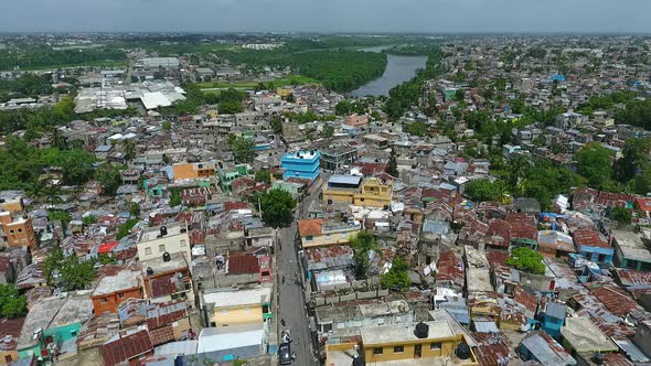 Aerial 4k view overlooking the Capotillo cityscape streets and houses, in Santo Domingo, Dominican R alt