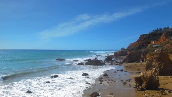 Aerial shot of ocean shore at El Matador Beach in Malibu, Califronia, USA alt