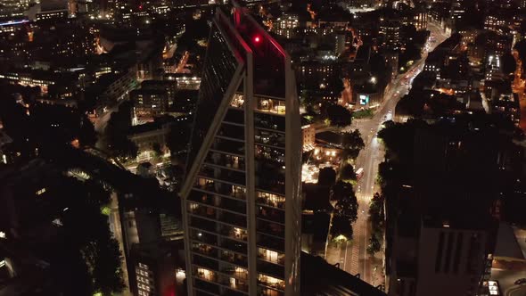 High Angle View of Modern Design Tall Residential Building and Urban District in Background alt