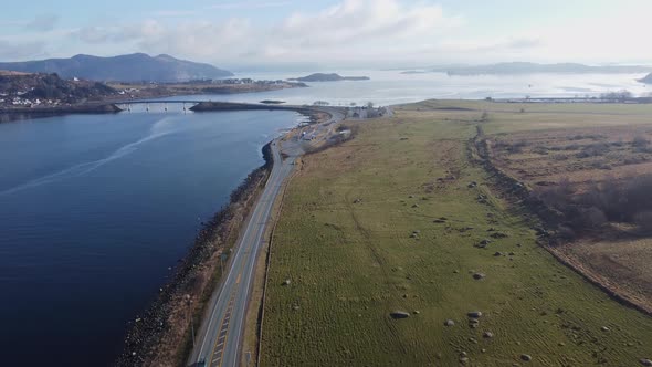 Road E39 north side of subsea tunnel Byfjordtunnel looking towards Askjesundet bridge and Hidlefjord alt
