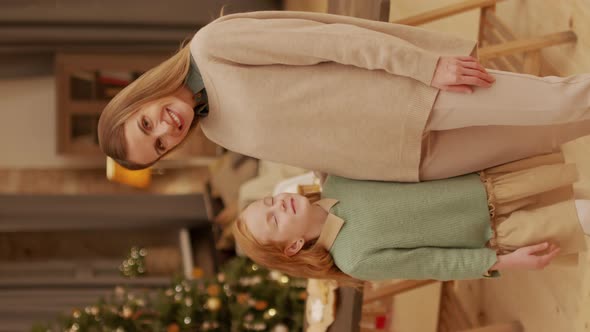 Mother And Daughter Celebrating Christmas alt