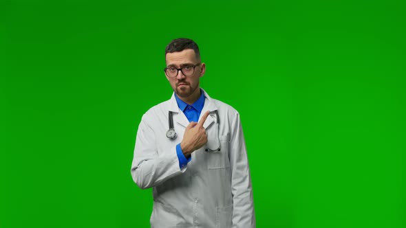 Caucasian Doctor Isolated on Green Studio Background alt
