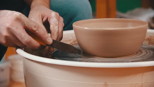 Pottery - the Master Is Helping Himself with a Special Modeling Tool alt