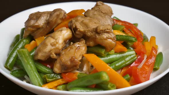 Thai noodles in a plate close up rotation. Ready serving dish on a rotating plate. restaurant food alt