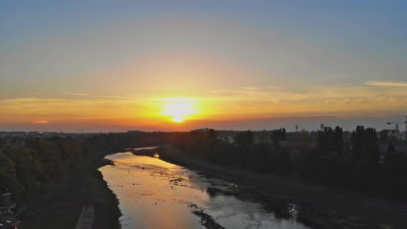 View from the height of the city on the roofs of houses, trees, mountains in over the Uzh River alt