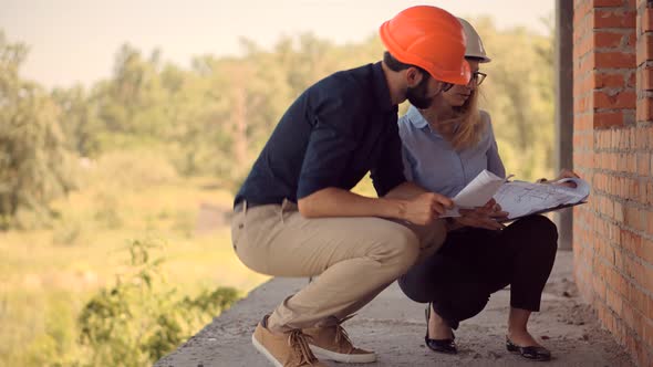 Developer On Construction Site. Civil Engineer Architect On Construction. Two Engineer Builder. alt