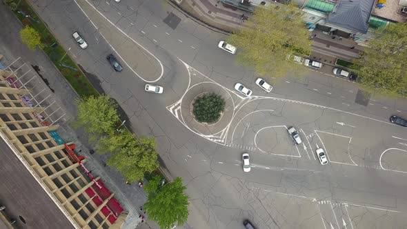 Road junction with cars aerial view. Car traffic on the markings.