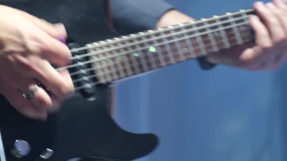 Close Up Shot of a Man with His Fingers on the Frets of a Guitar Playing alt