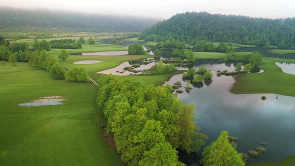 Flooded countryside after a heavy rain with fields and roads alt