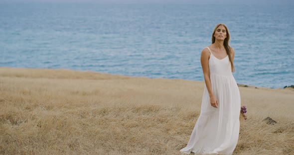 Beautiful woman in golden fields alt