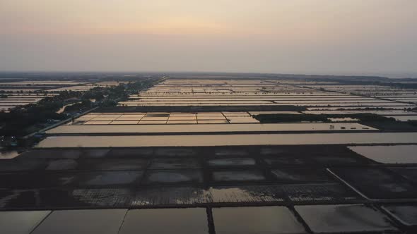 Aerial top view of natural sea salt ponds. Farm field outdoor. Material in traditional industry alt