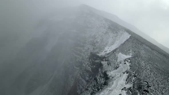 a large crater of a volcano in the snow