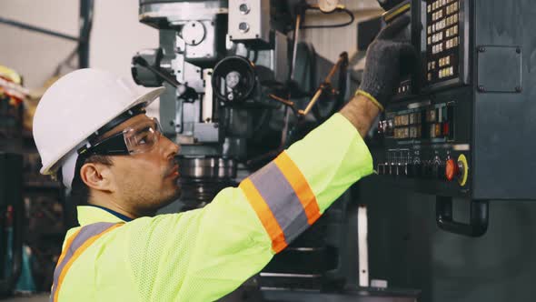 Smart Factory Worker Using Machine in Factory Workshop alt