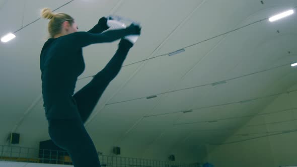 Young Caucasian woman skating and whirling around herself