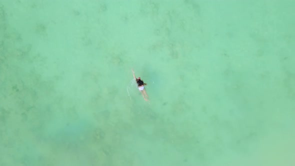 Aerial view of happy Asian woman swimming at turquoise sea in Phuket.Thailand alt