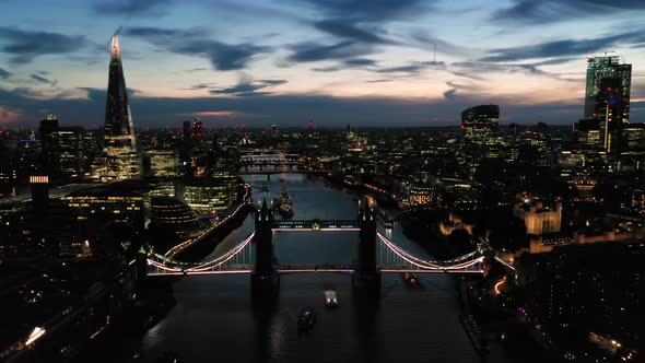 Aerial View of London over the River Thames including Tower Bridge, Shard and the Tower of London at alt