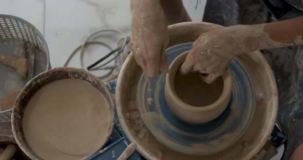 Flat Lay of Potter Master at Work in Clay Studio Handmade Process of Creating Pot on a Pottery Wheel