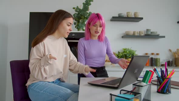 Cheerful Pretty Female Roommates Making Video Call Online Using Laptop Pc alt