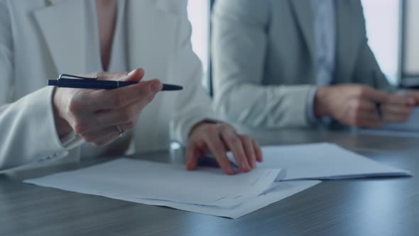 Closeup Hand Put Signature on Corporate Documents alt