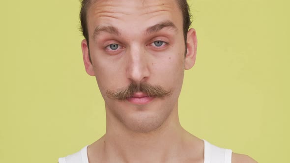 Expressive Gentleman Smiling Blinking and Joyfully Playing with Eyebrows Closeup alt