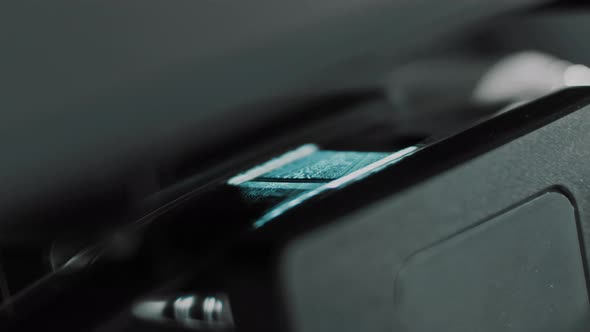 Close up of super-35mm silent movie film being scanned in a telecine machine alt