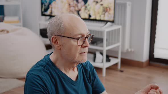 Close Up of Retired Person Relaxing with Meditation Activity alt
