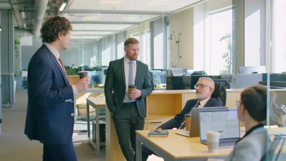 Colleagues Chatting on Coffee Break in Office alt