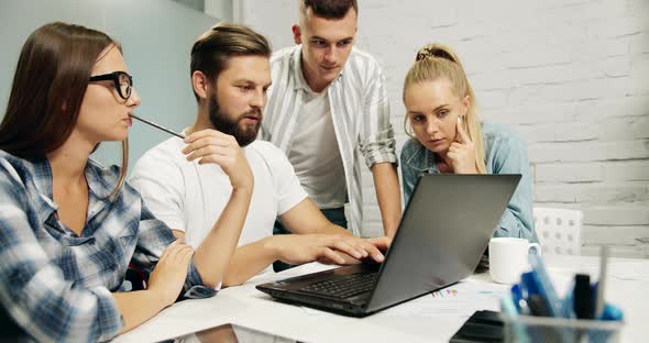 Teamwork in Office on Laptop